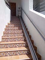 Silla salvaescaleras Acorn exterior instalada en una casa unifamiliar en Valencia